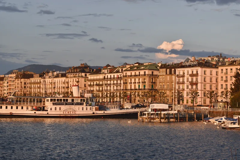 Lake Geneva waterfront and Geneva facades at sunset